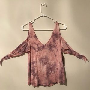 Purple-pink tie dye shirt that ties at the arms.
